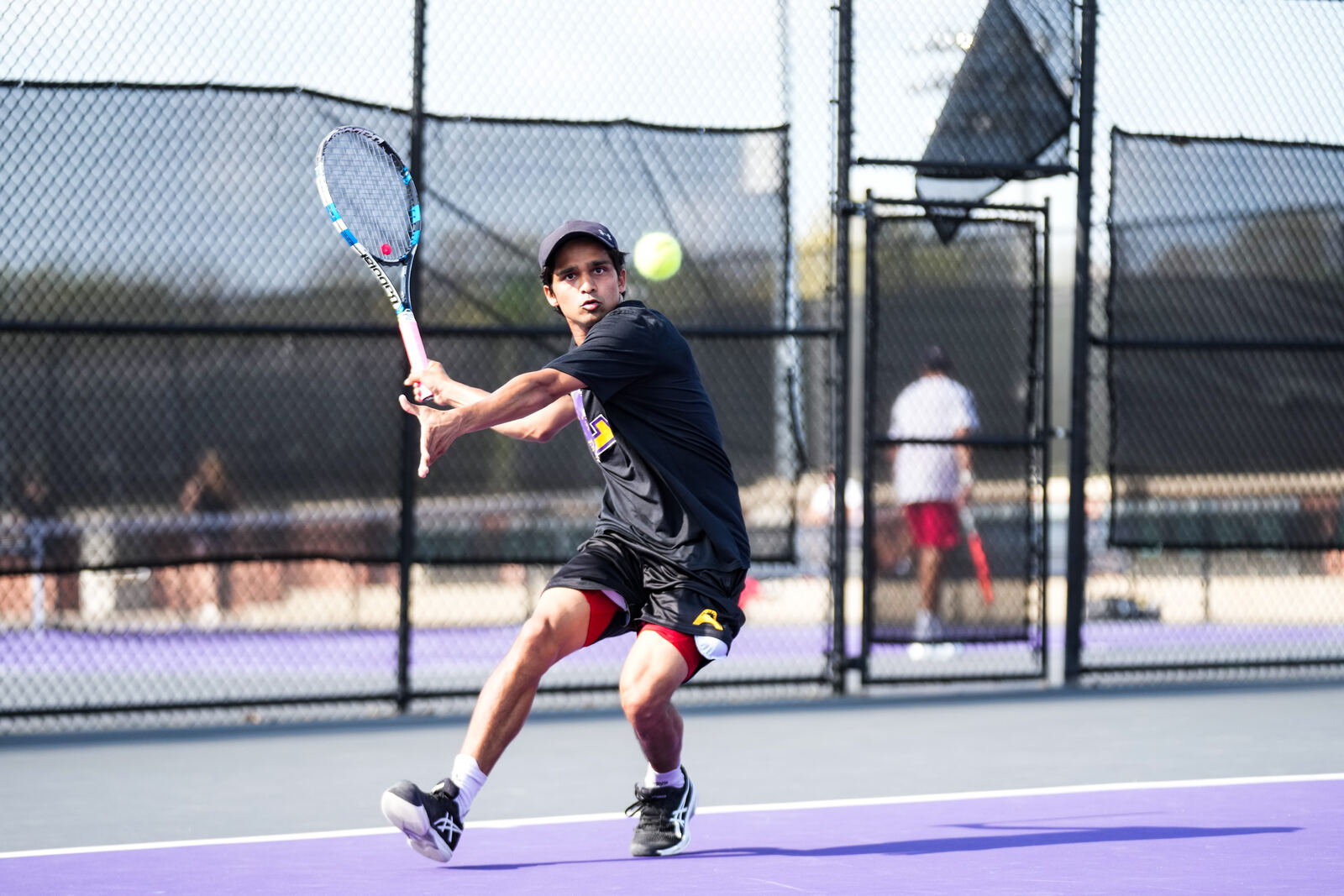 Vikash Singh returning a serve